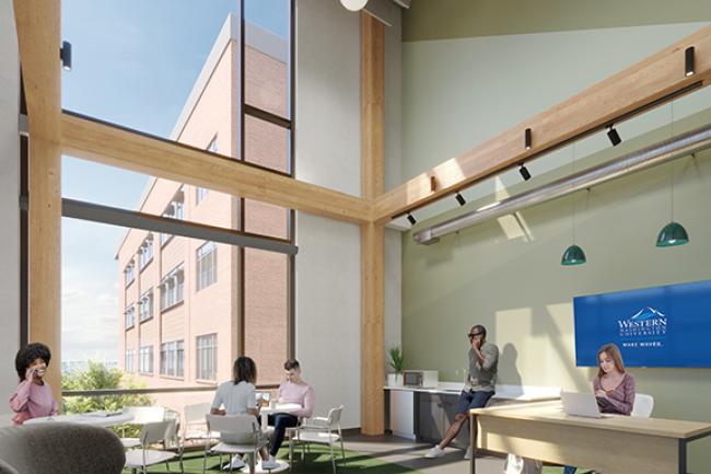 Students study and chat in a lounge with large windows, wooden beams, desks and casual chairs