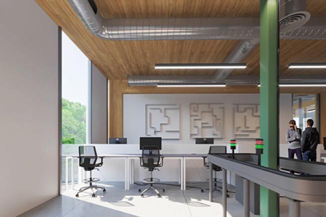 Two people talk in the corner of a lab space with wooden ceilings, workstations, and diagrams on the walls